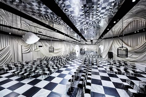 bureau betak designs surrealist checkered pavilion for dior's .